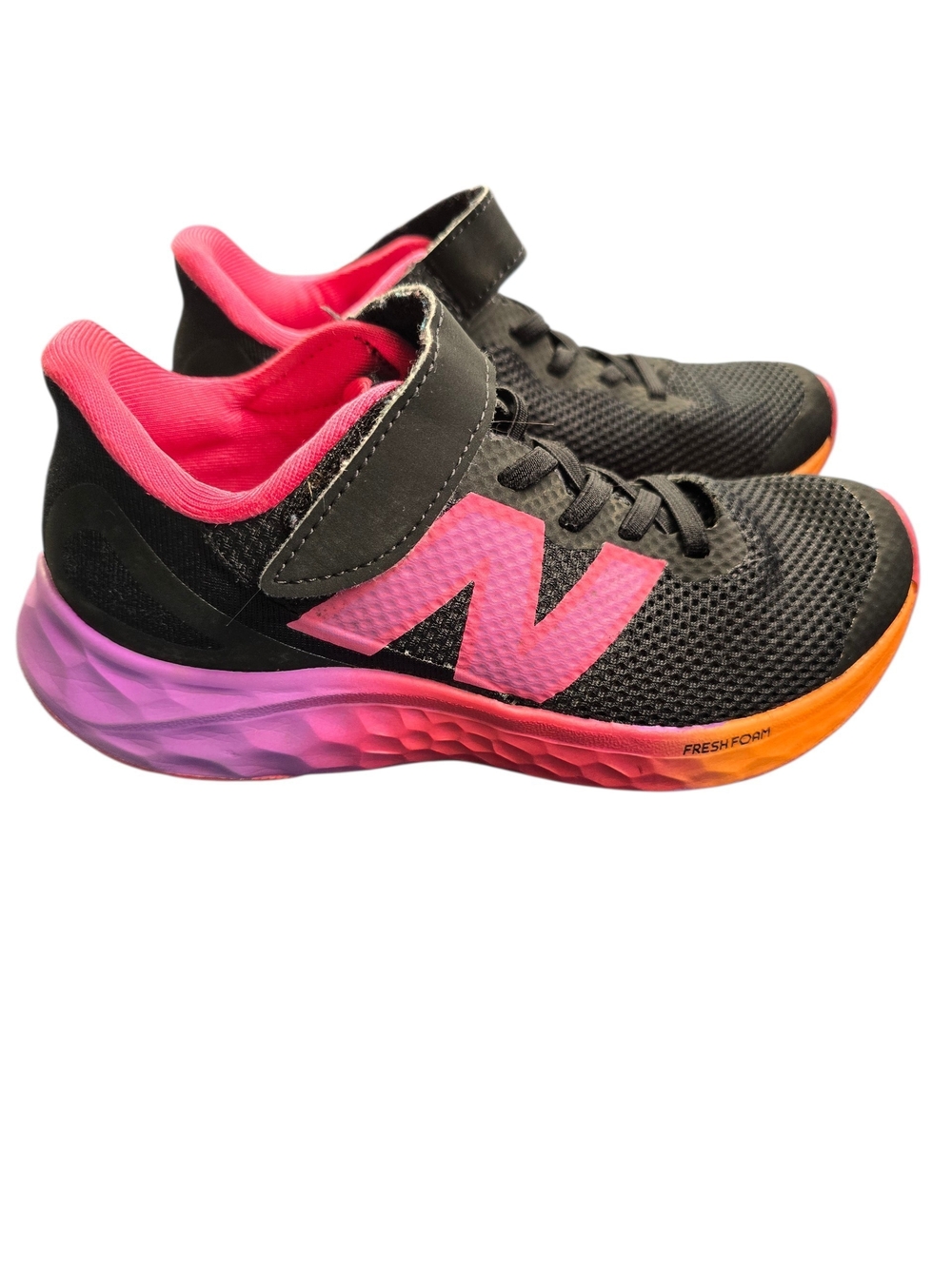 New Balance Kids Black Sneakers with Pink and Orange Gradient Sole